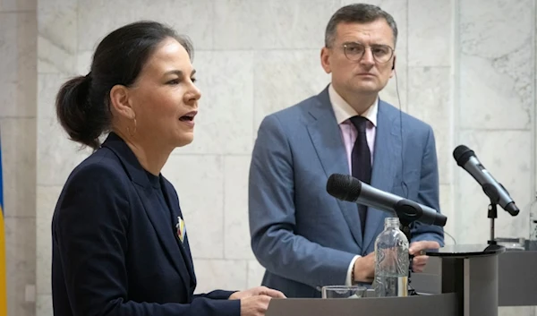 German Foreign Minister Annalena Baerbock, left, and Ukrainian Foreign Minister Dmytro Kuleba answer media questions during their press conference in Kyiv, Ukraine, Tuesday, May 21, 2024. (AP)