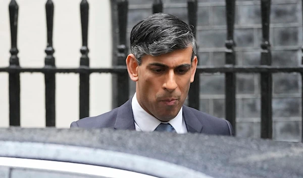 Britain's Prime Minister Rishi Sunak leaves 10 Downing Street to go to the House of Commons for his weekly Prime Minister's Questions in London, on Wednesday, May 22, 2024. (AP)