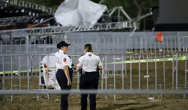 Security forces stand around a stage that collapsed during an event attended by presidential candidate Jorge Álvarez Máynez in San Pedro Garza García in Mexico, Wednesday, May 22, 2024. (AP)