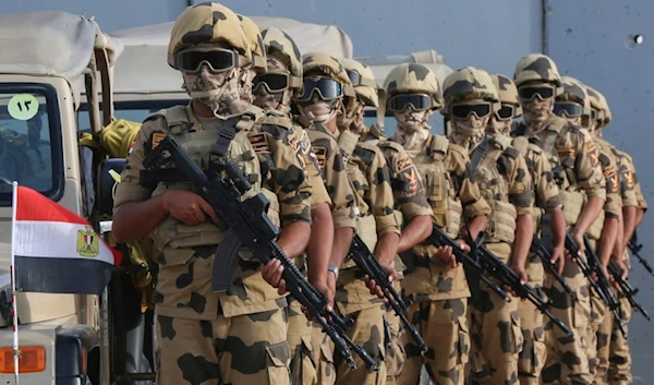 Military personnel stand alert at the Rafah border crossing between Egypt and Gaza Strip, in Rafah, Egypt, Tuesday, Oct. 31, 2023. (AP)