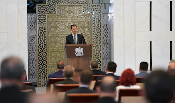 In this photo released by the Syrian official news agency SANA, Syrian President Bashar al-Assad addresses the parliament, in Damascus, Syria, Wednesday, Aug. 12, 2020. (AP)