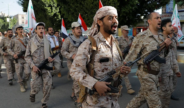 Ansar Allah supporters march marking the anniversary of Yemeni unity in Sanaa, Yemen, May 22, 2024 (AP)