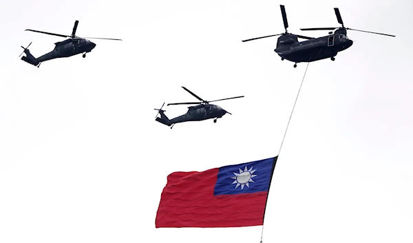 Helicopters fly over with Taiwan national flag during an inauguration celebration of Taiwan's President Lai Ching-te in Taipei, Taiwan, on May 20, 2024. (AP)