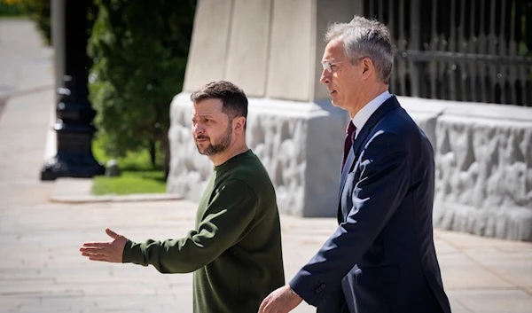 Ukrainian President Volodymyr Zelenskyy, left, welcomes NATO Secretary General Jens Stoltenberg walk before their press conference in Ukraine, Monday, April 29, 2024. (AP)