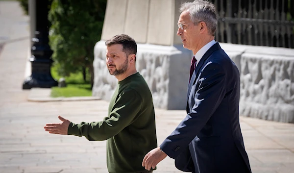 Ukrainian President Volodymyr Zelenskyy, left, welcomes NATO Secretary General Jens Stoltenberg walk before their press conference in Kiev, Ukraine, April 29, 2024 (AP)