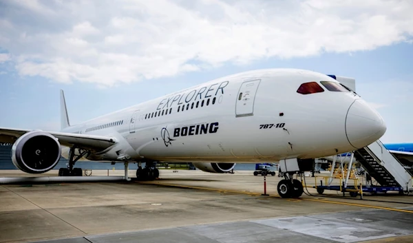 A Boeing eco-Demonstrator Explorer, a 787-10 Dreamliner, sits on the tarmac at their campus in North Charleston, S.C., May 30, 2023 (AP)