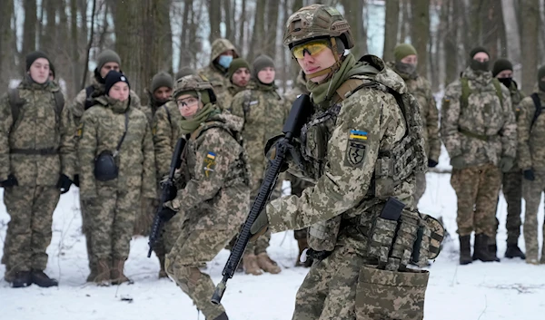 Members of Ukraine's Territorial Defense Forces, volunteer military units of the Armed Forces, train in a city park in Kiev, Ukraine, Saturday, Jan. 22, 2022. (AP)