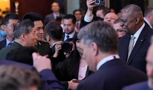 US Defense Secretary Lloyd Austin shakes hands during the 20th International Institute for Strategic Studies (IISS) Shangri-La Dialogue, Asia's annual defense and security forum, in Singapore, Friday, June 2, 2023. (AP)