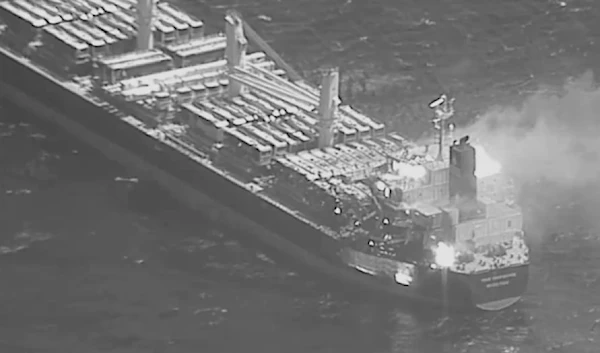 This black-and-white image released by the US military's Central Command shows the fire aboard the bulk carrier True Confidence after a missile attack by the Yemeni Armed Forces in the Gulf of Aden, March 6, 2024 (AP)