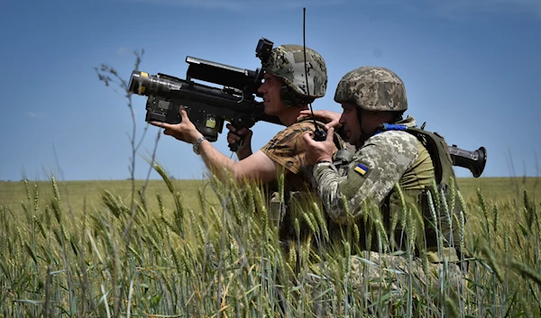 Ukrainian servicemen search a target with a US Stinger air defence missile launcher on the front line in Zaporizhzhia region, Ukraine, Tuesday, May 28, 2024. (AP)