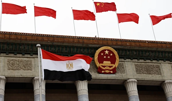 An Egyptian flag is fluttered before a welcome ceremony for Egyptian President Abdel Fattah al-Sisi at the Great Hall of the People in Bejing, Wednesday, May 29, 2024. (AP)