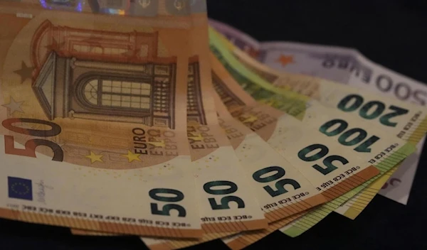 Euro banknotes are displayed on a table in Munich, Germany on March 30, 2022. (AP)