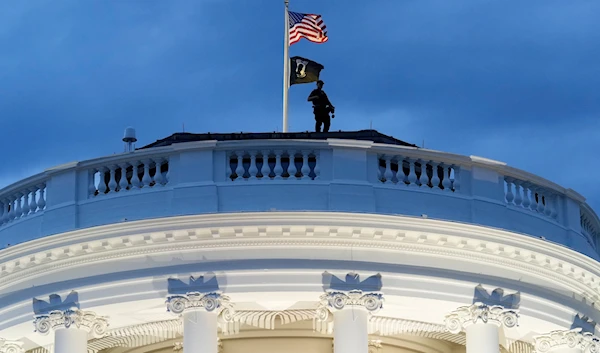 A member of the U.S. Secret Service stands on the roof of the White House during a Juneteenth concert on the South Lawn of the White House in Washington, on June 10, 2024. (AP)