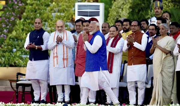 Narendra Modi greets the gathering as he arrives to take oath as the Prime Minister of India at the Rashtrapati Bhawan, in New Delhi, India, on June 9, 2024. (AP)