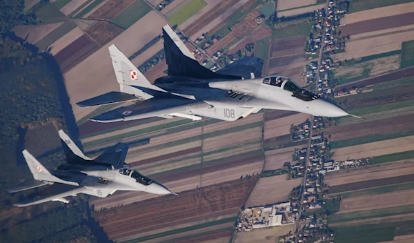 Two Polish MiG-29 fighter jets taking part in a Nato exercise near the air base in Lask, central Poland, in 2022. (AFP / Getty Images)