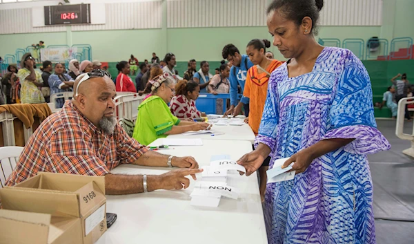 A woman participates in a referendum in Noumea, New Caledonia, Sunday, Oct. 4, 2020, whether voters choose independence from France. (AP)