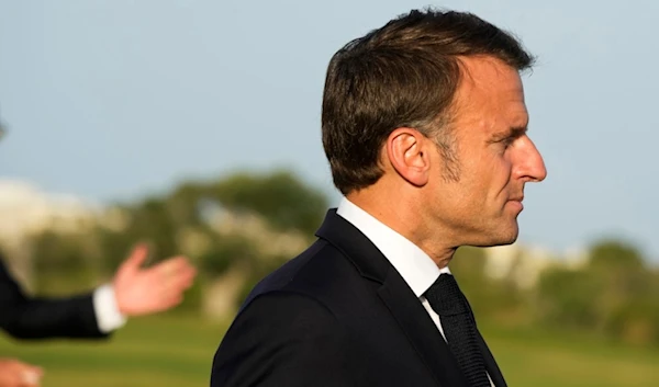 French President Emmanuel Macron arrives to talk to journalists after watching a skydiving demo during the G7 world leaders summit at Borgo Egnazia, Italy, Thursday, June 13, 2024. (AP)