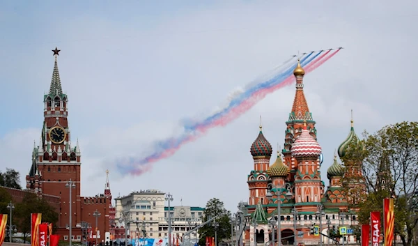 Russian Air Force Su-25 jets fly over Red Square leaving trails of smoke in the colours of the Russian national flag during the Victory Day military parade in Moscow, Russia, May 9, 2024. (AP)