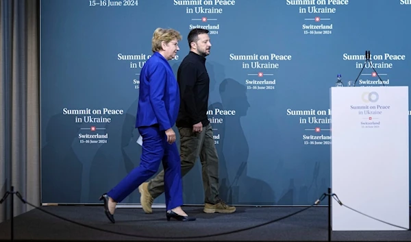 Swiss Federal President Viola Amherd and Ukraine's President Volodymyr Zelenskyy arrive at a news conference during the Ukraine peace summit in Buergenstock, Switzerland, June 15, 2024. (AP)