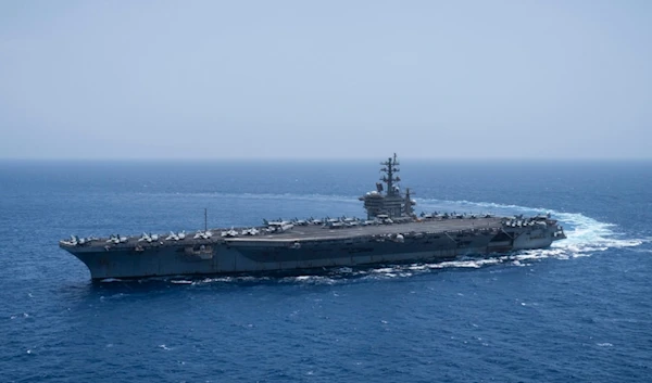 FILE - The USS aircraft carrier Dwight D. Eisenhower, also known as 'IKE', sails in the Red Sea on Wednesday, June 12, 2024. (AP Photo/Bernat Armangue, File)