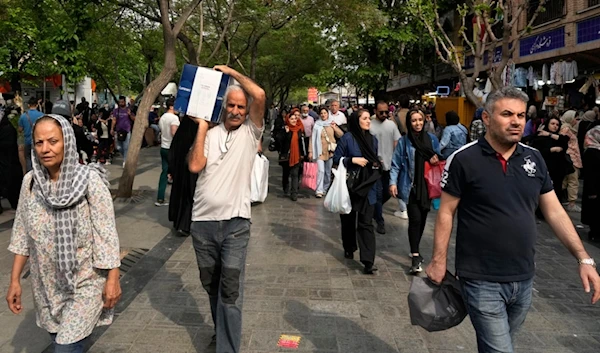 Illustrative image of people shopping at the old main bazaar in Tehran, Iran, Tuesday, April 16, 2024 (AP Photo/Vahid Salemi)