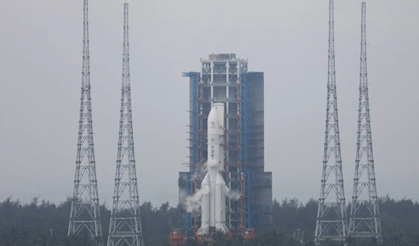 The Chang'e 6 lunar probe and the Long March-5 Y8 carrier rocket combination sit atop the launch pad at the Wenchang Space Launch Site in Hainan province, China May 3, 2024. (AFP)