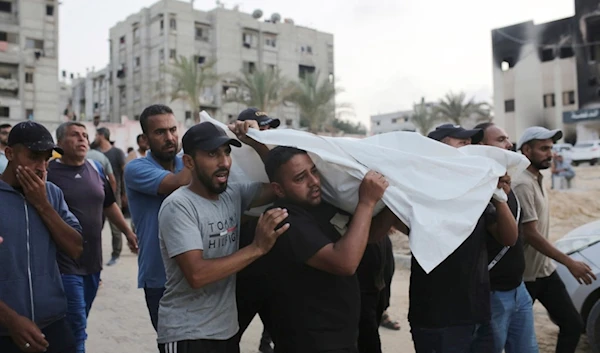 Palestinians carry a person killed by Israeli bombardment to their burial in Khan Younis, southern Gaza Strip, Friday, June 21, 2024. (AP Photo /Jehad Alshrafi)