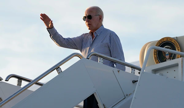 President Joe Biden waves as he boards Air Force One at Dover Air Force Base, Delaware, June 20, 2024 (AP)