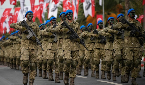 Turkey's army soldiers in a parade as part of celebrations marking the 100th anniversary of the creation of the modern, secular Turkish Republic, in Istanbul, Turkey, Sunday, October 29, 2023 (AP)