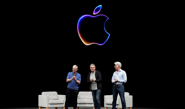 Apple CEO Tim Cook alongside two Apple VPs during an Apple event in Cupertino, Calif., Monday, June 10, 2024. (AP)