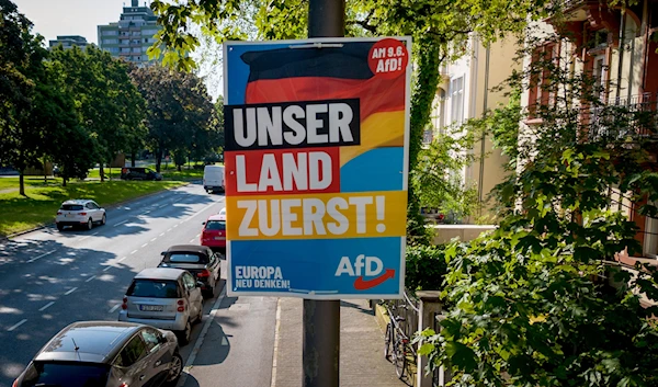 An AfD election poster for the European elections reading "our country first" is fixed on a pole in Frankfurt, Germany, Monday, May 13, 2024. (AP)