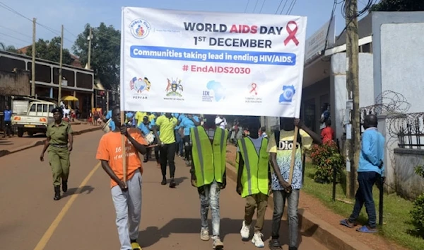 A group of Ugandan citizens mark World AIDS Day in Kampala, Uganda. (AFP/Getty Images)