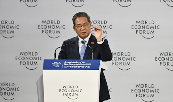 Chinese Premier Li Qiang delivers his speech during the opening ceremony of the World Economic Forum Annual Meeting of the New Champions (AFP)