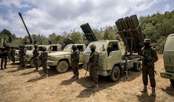 Members of the Lebanese Resistance group Hezbollah carry out a training exercise in Aaramta village in the Jezzine District, southern Lebanon, May 21, 2023. (AP)