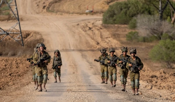 Israeli soldiers are seen near the Gaza Strip border in southern occupied Palestine, Thursday, June 13, 2024. (AP)