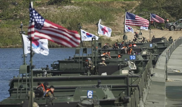 US and South Korean flags wave before a joint river-crossing drill between the allied nations in Yeoju, South Korea, October 19, 2022. (AP)