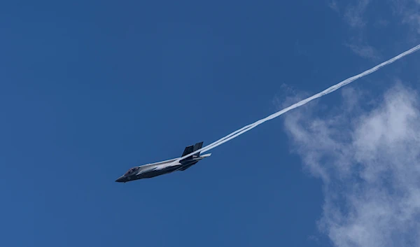 An Israeli air force F-35 war plane flies over Mount Herzl the military cemetery in "Israel" on Sunday, May 12, 2024. (AP)