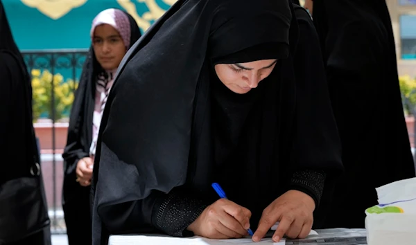 Iranian citizens, officials cast their votes for presidential election