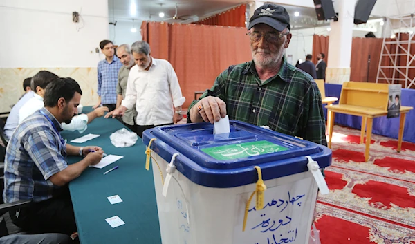 Polling stations open, Iranians head to vote in presidential elections