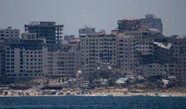 Destroyed buildings stand in the coast of the Gaza Strip as seen from the Mediterranean Sea, Tuesday, June 25, 2024. (AP Photo/Leo Correa)