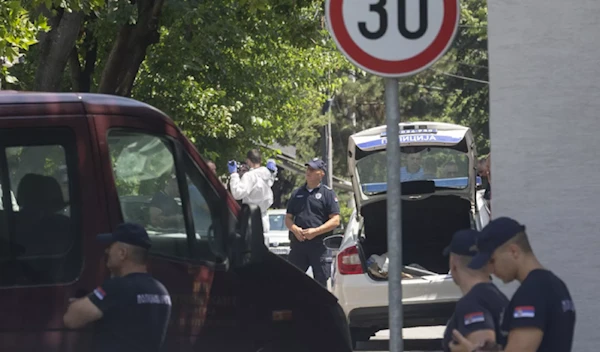 Police officers work at the scene close to the Israeli embassy in Belgrade, Serbia, on June 29, 2024. (AP)