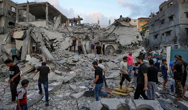 Palestinians look at the destruction after an Israeli airstrike in Deir al Balah, Gaza Strip, Tuesday, April 30, 2024. (AP)