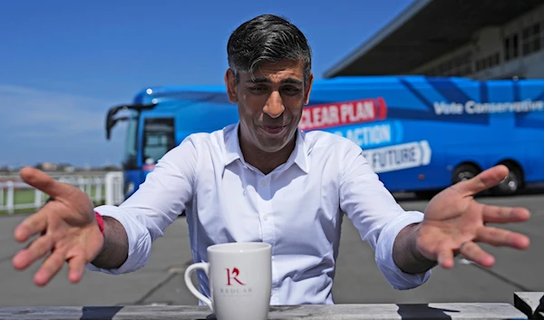 Britain's Prime Minister Rishi Sunak speaks to journalists at Redcar racecourse as launches the Conservative campaign bus, Saturday, June 1, 2024 in Redcar, England. (AP)