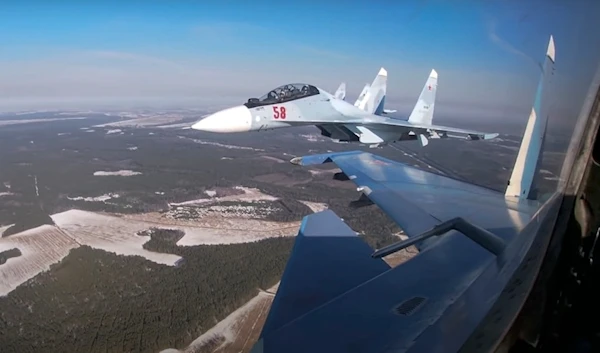 Screengrab by the Russian Defense Ministry Press Service on Feb. 17, 2022, Su-30 fighters of both air forces fly in a joint mission during the Union Courage-2022 Russia-Belarus drills in Belarus. (AP)