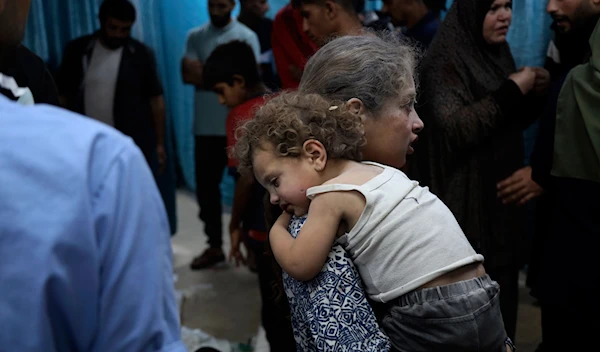 Palestinian children wounded in the Israeli bombardment on a residential building are brought to al-Aqsa Martyrs hospital in Deir al-Balah, June 4, 2024. (AP)