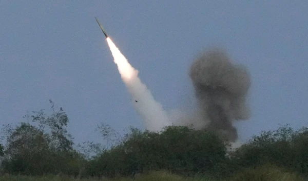 A US M142 High Mobility Artillery Rocket System (HIMARS) fires a missile during a Combined Joint Littoral Live Fire Exercise at the Balikatan joint military exercise in a Naval station in Zambales province, northern Philippines, April 26, 2023 (AP)