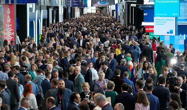 People visit the St. Petersburg International Economic Forum in St.Petersburg, Russia, June 6, 2024 (AP)