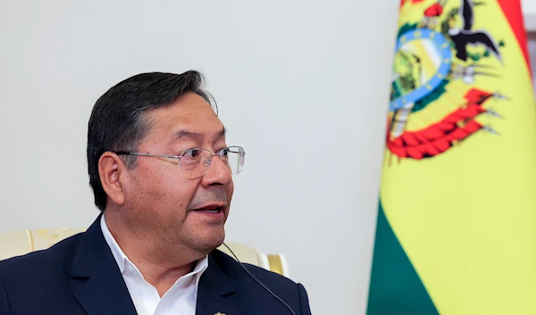 Bolivia's President Luis Arce speaks to Russia's President Vladimir Putin during their talks on the sidelines of the St. Petersburg International Economic Forum in St. Petersburg, Russia, on June 6, 2024. (AP)