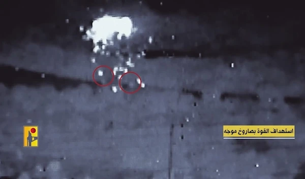 A screengrab from a video released by the Hezbollah military media showing the targeting of an Israeli occupation forces gathering. (Military media)