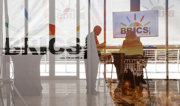 Delegates interact during the 2023 BRICS Summit in Johannesburg, South Africa, on August 23, 2023. (AP)